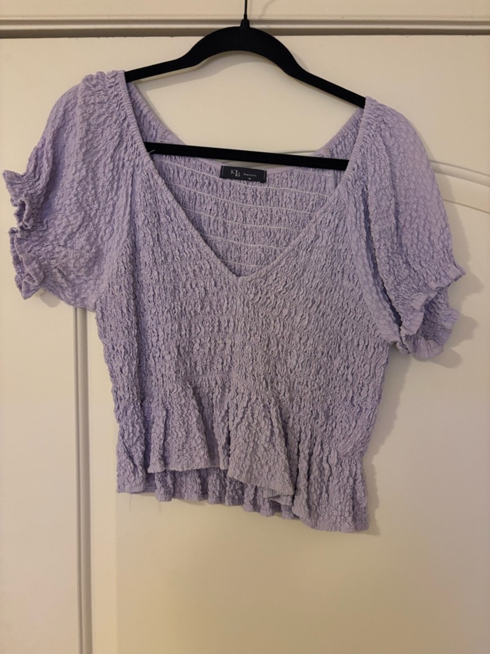 Smocked V-Neck Peplum Blouse in Light Lavender